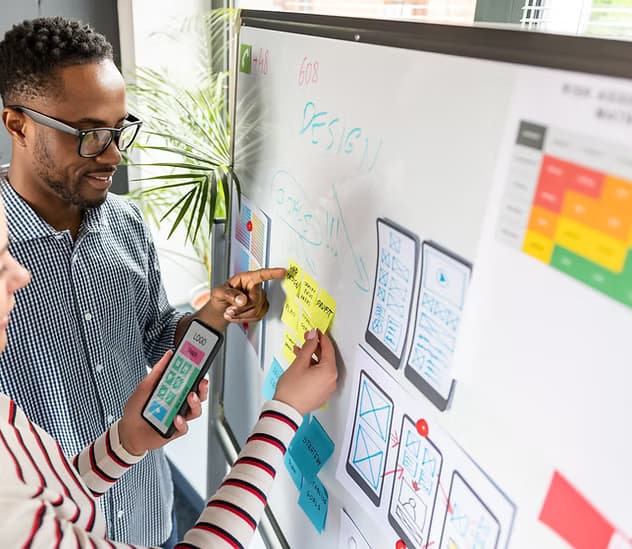 A design team mapping out an interface